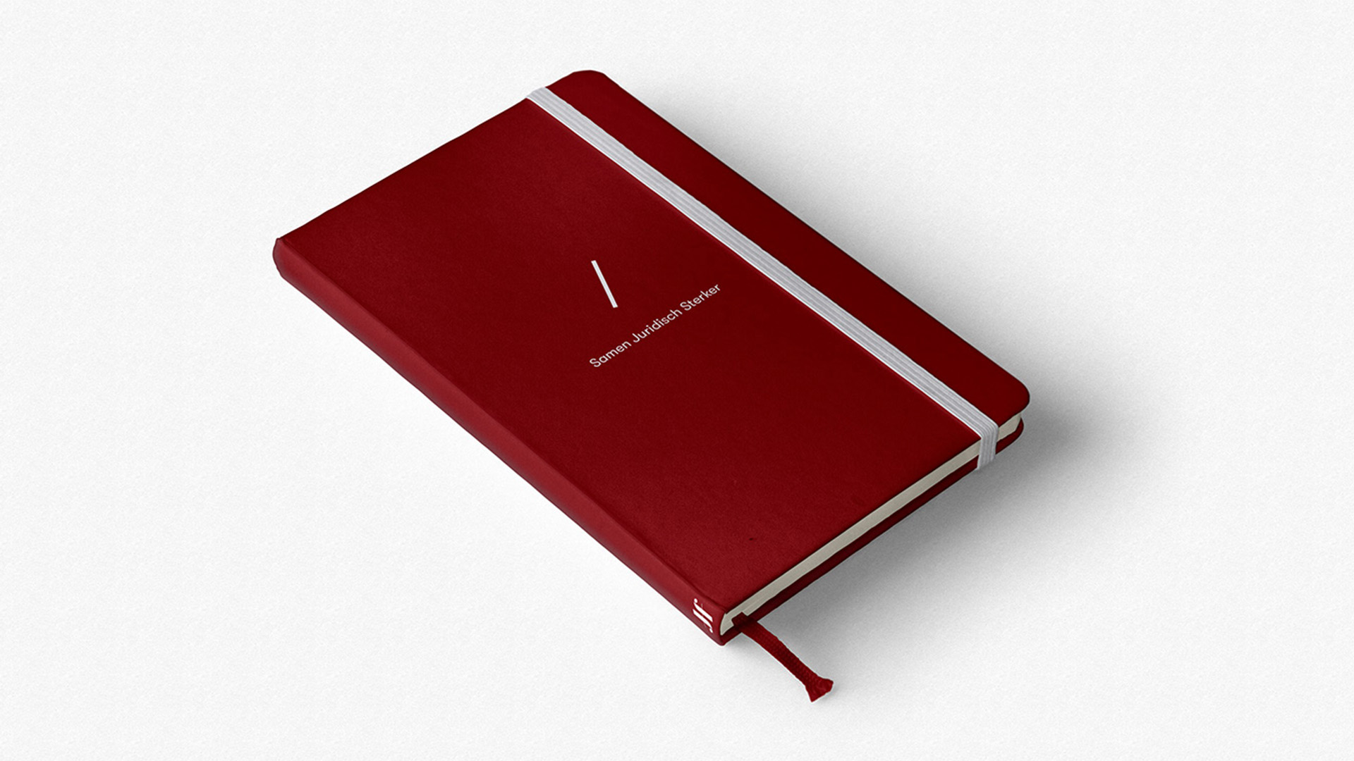 Een notitieboekje in de rode huisstijl kleur van HJF met het logo